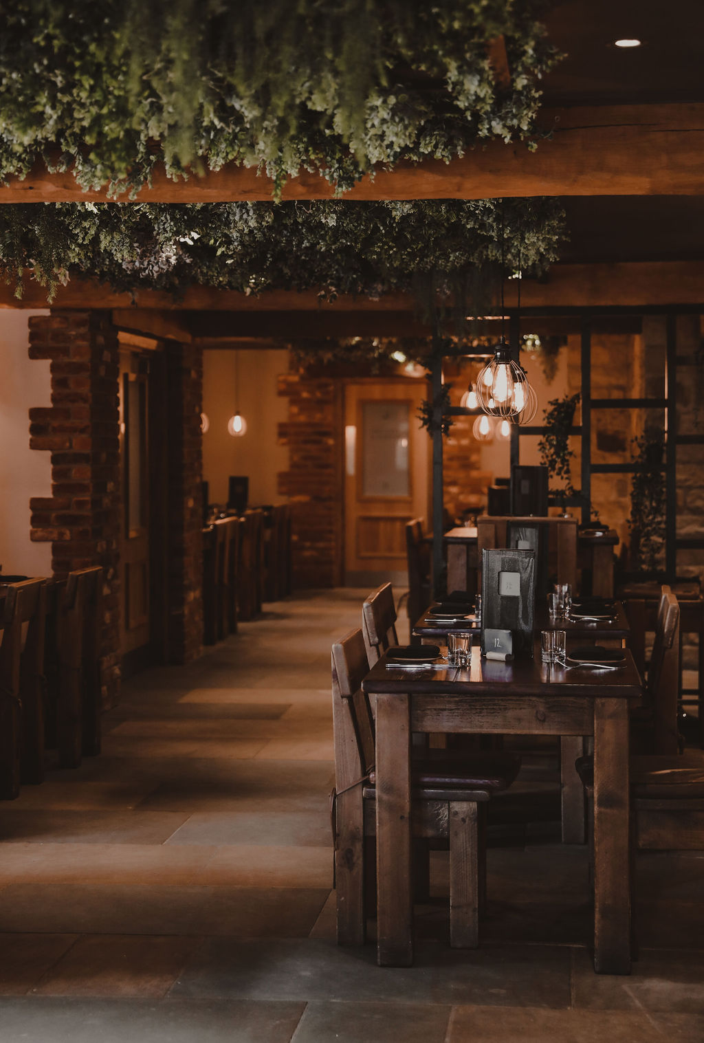 Looking down the restaurant with tables set