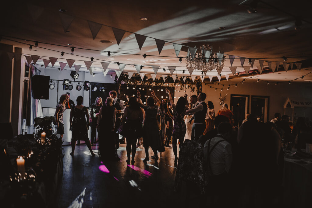 dance floor with people dancing in a busy room